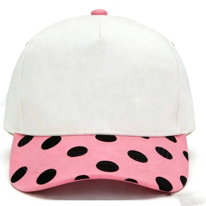 Canvas hat with pink/black polka dots bill on the brim