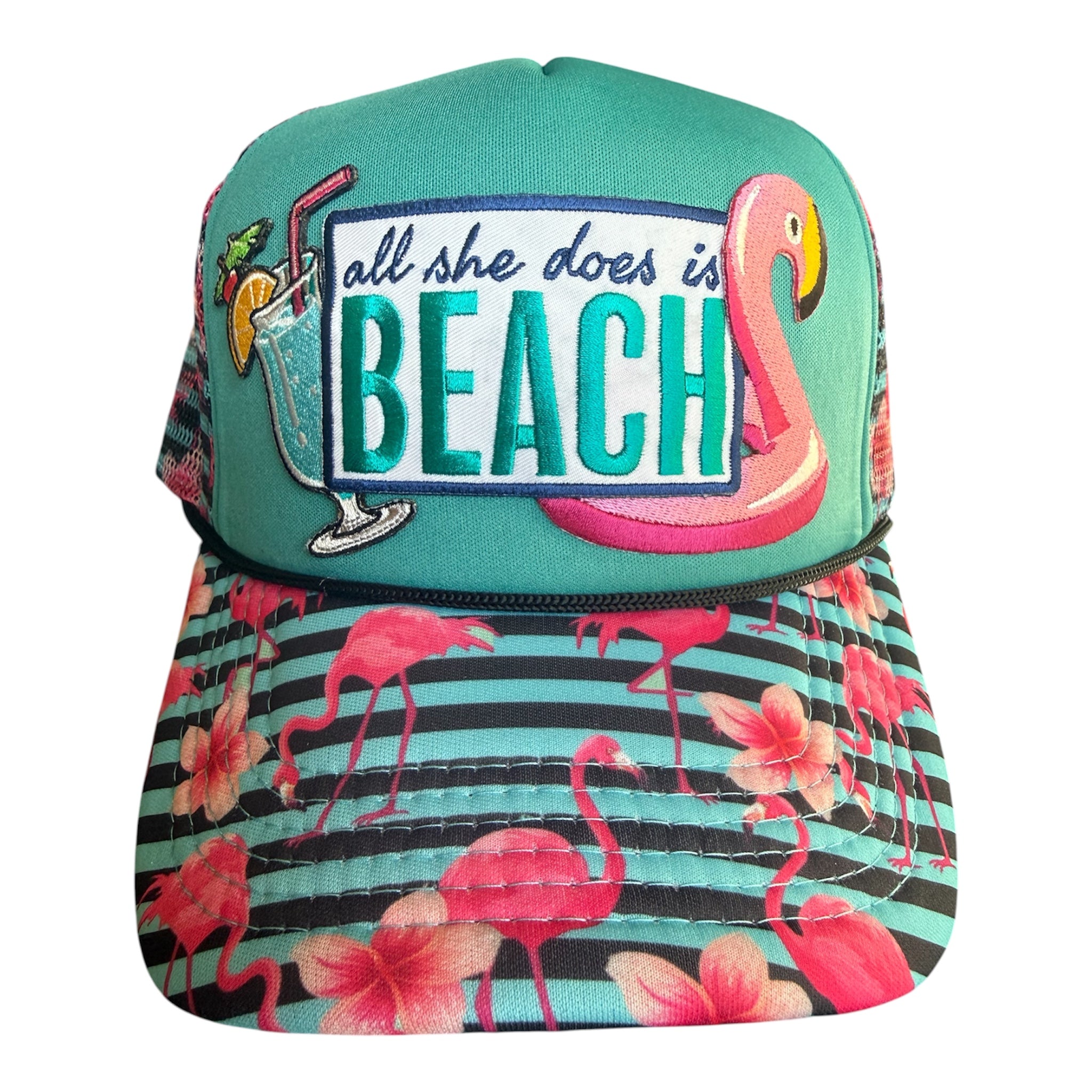 All she does is BEACH flamingo printed trucker