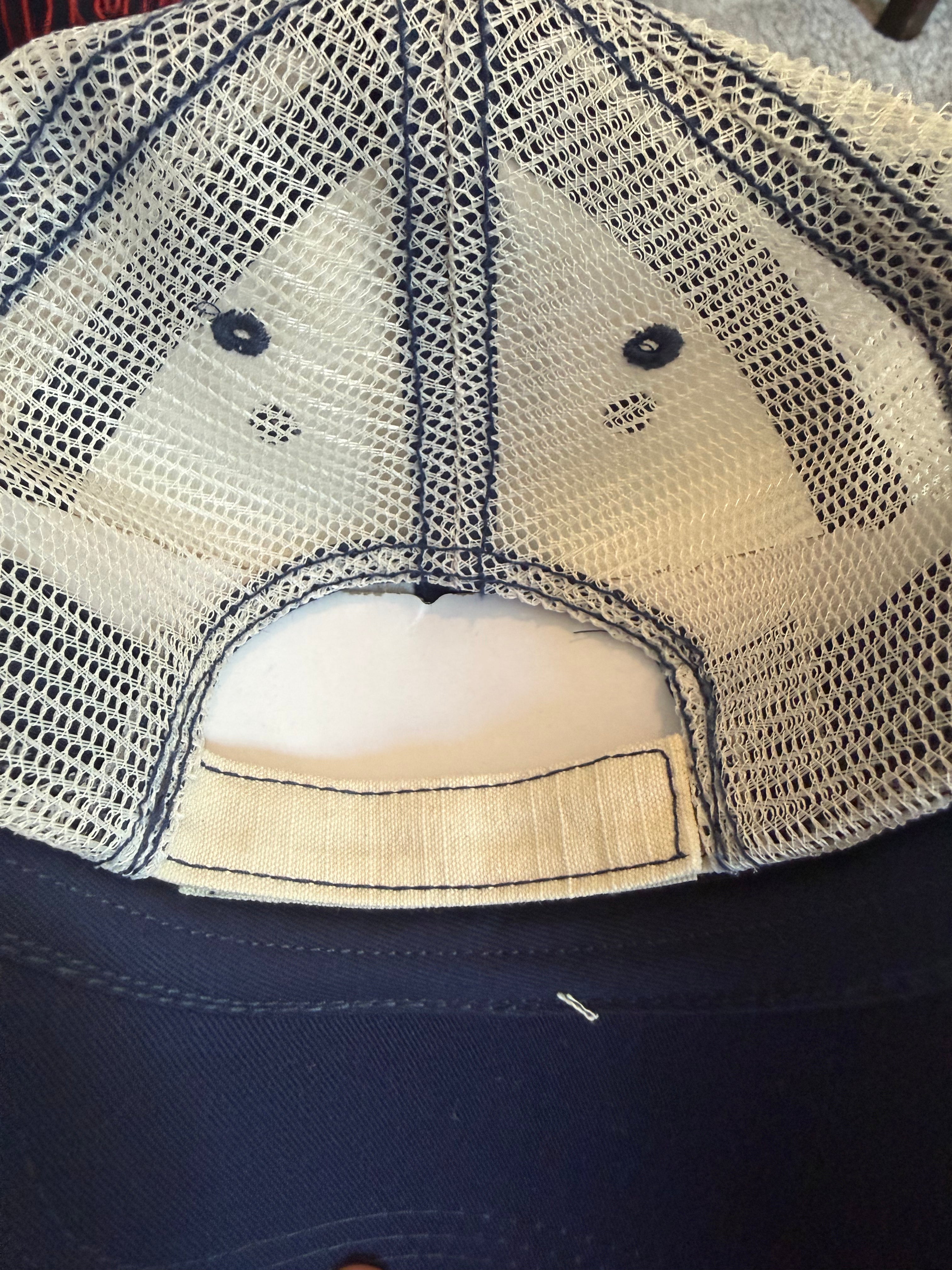 Sparks Vb cream trucker hat with blue stitching and circle patch